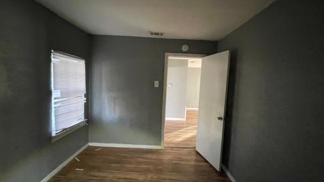 3313 Hatcher Street Fort Worth, TX 76119 - Photo 11 of 15 an empty room with windows