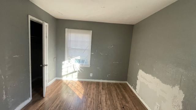 3313 Hatcher Street Fort Worth, TX 76119 - Photo 13 of 15 a view of empty room with wooden floor