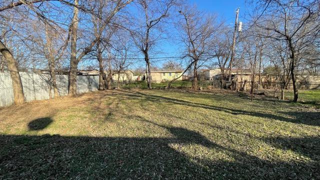 3313 Hatcher Street Fort Worth, TX 76119 - Photo 5 of 15 a view of road with large trees