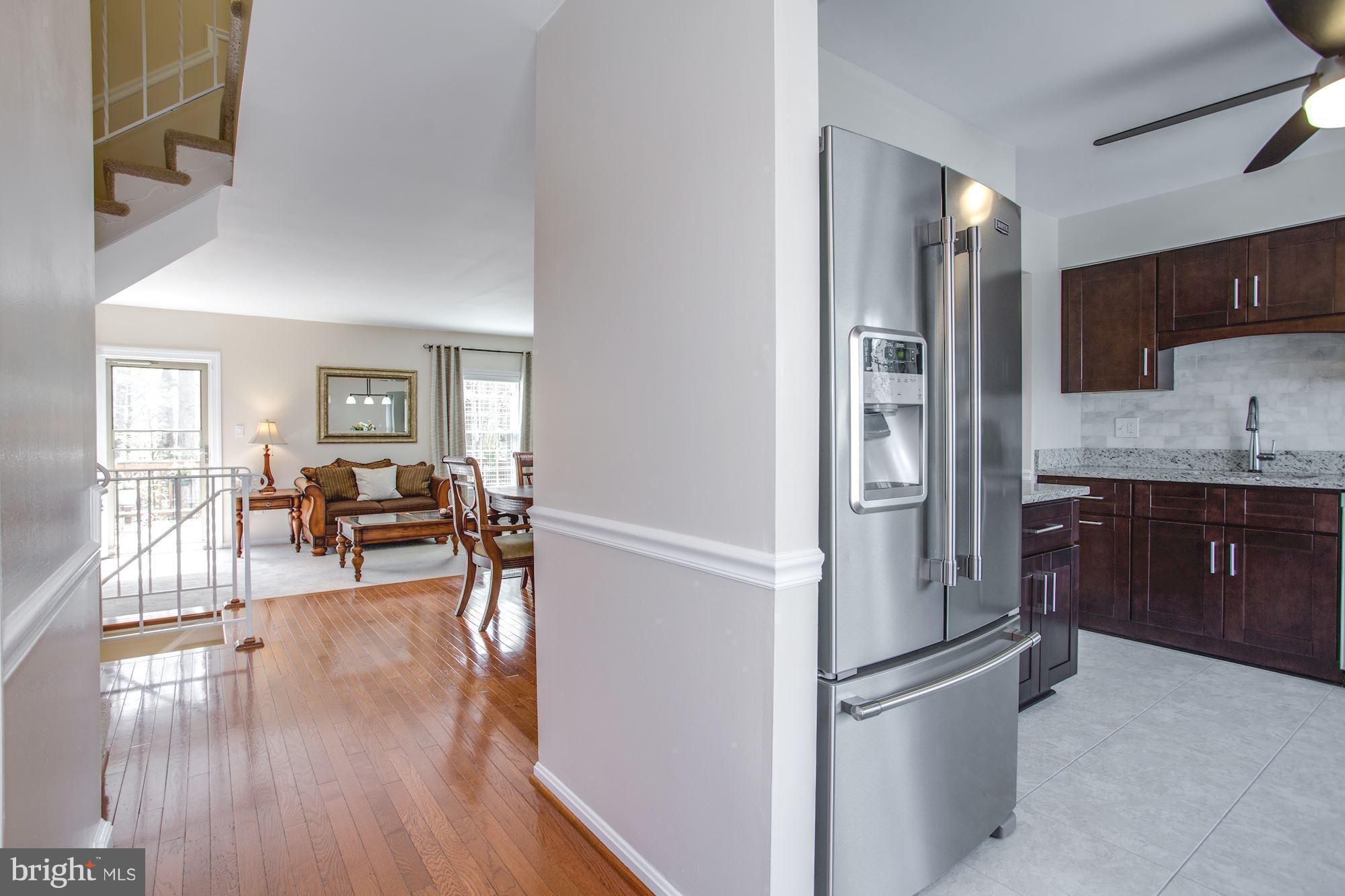 7328 Spring View Court Springfield, VA 22153 - Photo 2 of 30 Bright hardwood floors on main level.