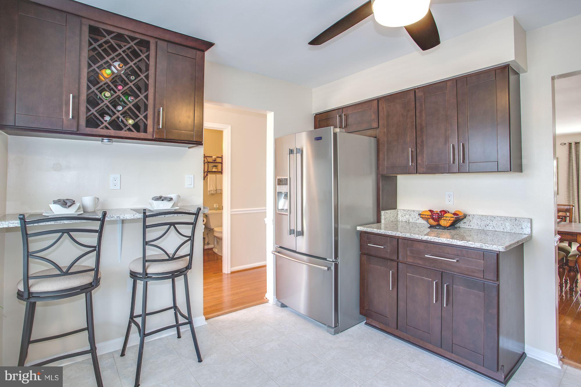 7328 Spring View Court Springfield, VA 22153 - Photo 4 of 30 Breakfast bar and wine rack. Happy hour!