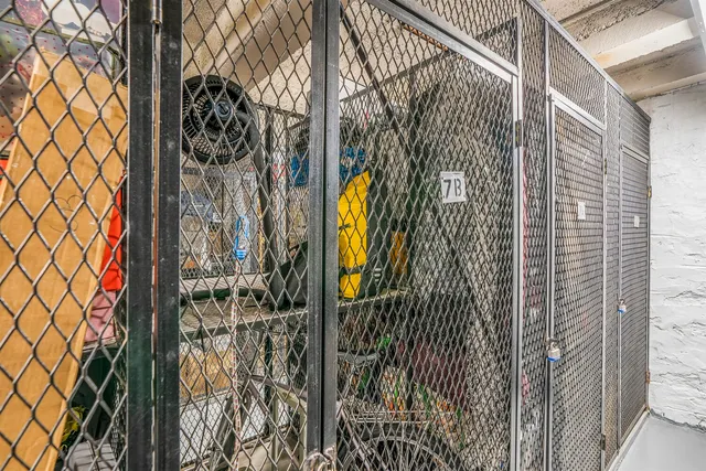 a view of a wooden door with a tree in front of it