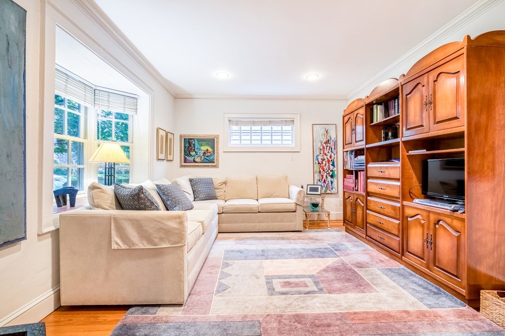 222 Bonad Road Brookline, MA 02467 - Photo 2 of 30 a living room with furniture or couch and a window
