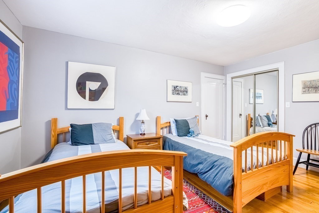 222 Bonad Road Brookline, MA 02467 - Photo 22 of 30 a bedroom with furniture and wooden floor