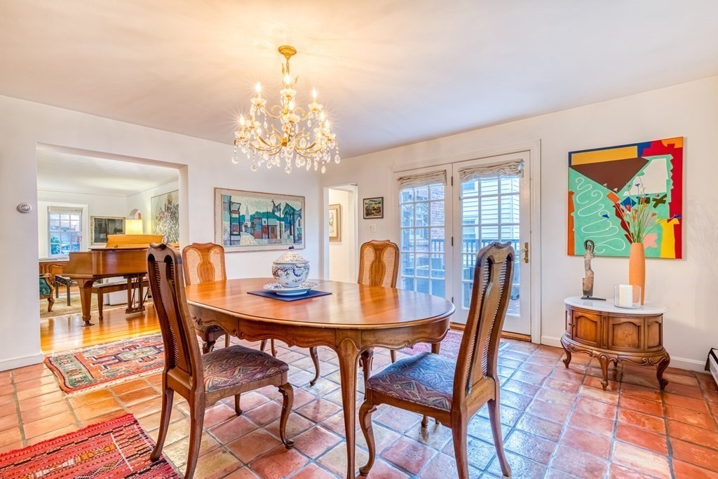 222 Bonad Road Brookline, MA 02467 - Photo 7 of 30 a view of a dining room with furniture and chandelier