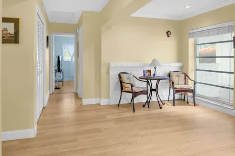 a view of a livingroom with furniture and a window