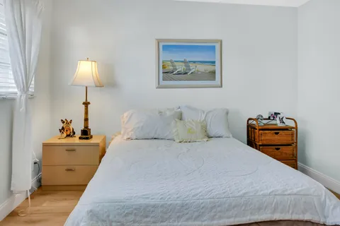 a bedroom with bed and window