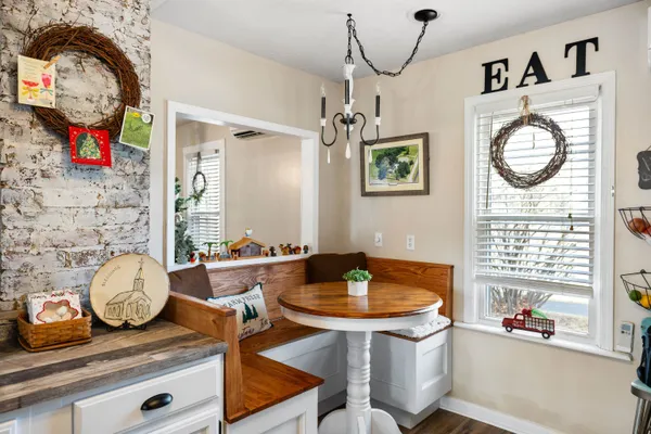 a kitchen with stainless steel appliances granite countertop a sink and cabinets