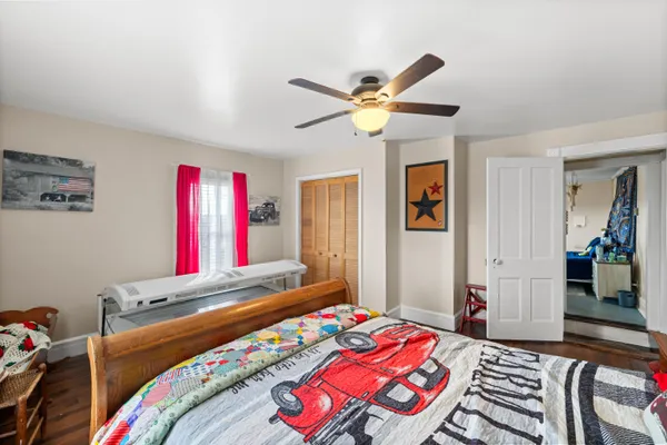 a view of a room with lots of stuff and hardwood floor