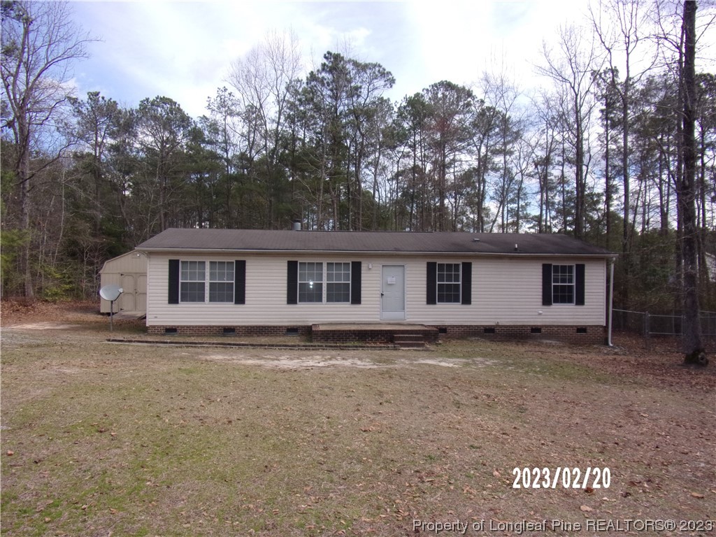 a house with trees in the background