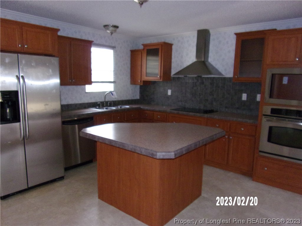 145 Box Elder Terrace Cameron, NC 28326 - Photo 6 of 17 a kitchen with stainless steel appliances granite countertop a sink a stove and a refrigerator