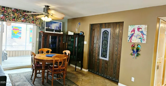 a dining room with furniture and window
