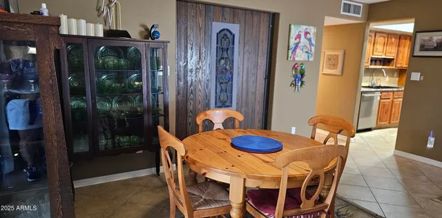 a bathroom with a sink mirror and vanity