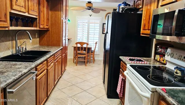 a kitchen that has a sink and a stove