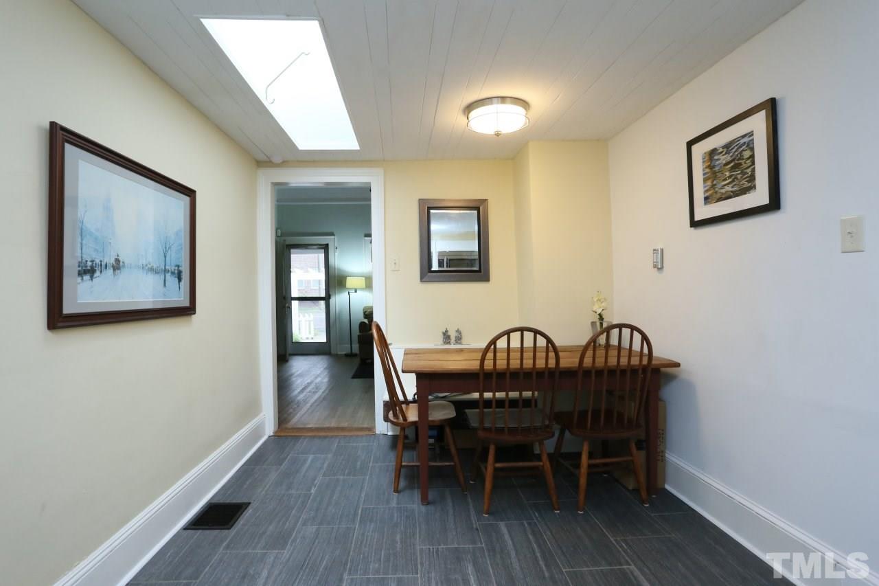 526 North Person Street Raleigh, NC 27604 - Photo 12 of 25 a view of a dining room with furniture and wooden floor