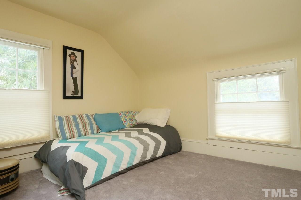 526 North Person Street Raleigh, NC 27604 - Photo 16 of 25 a bedroom with a bed and a window