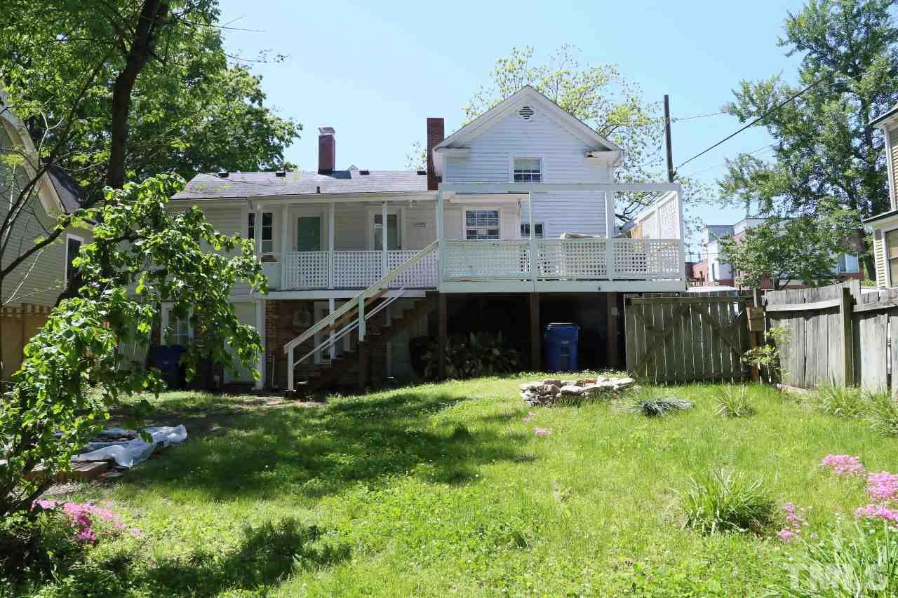 526 North Person Street Raleigh, NC 27604 - Photo 21 of 25 a front view of house with yard and trees in the background