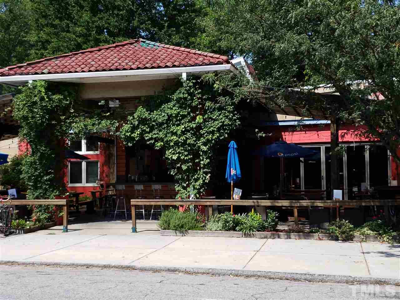 526 North Person Street Raleigh, NC 27604 - Photo 24 of 25 a view of a cafe with table and chairs under an umbrella