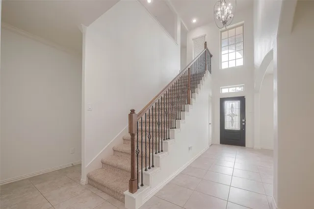 a view of entryway and hall with a front door