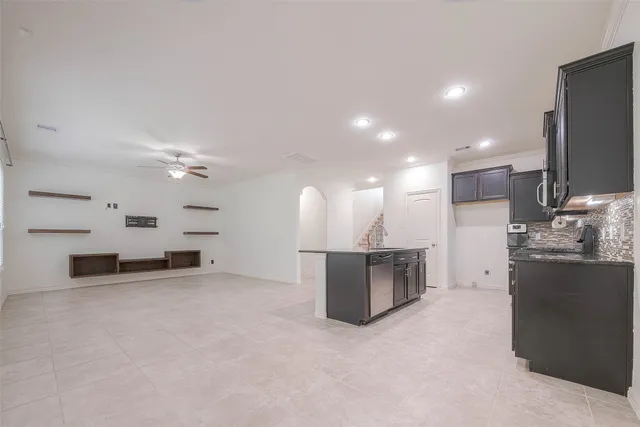 a view of kitchen and kitchen with microwave