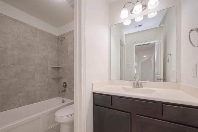 a bathroom with a sink a toilet and a bathtub
