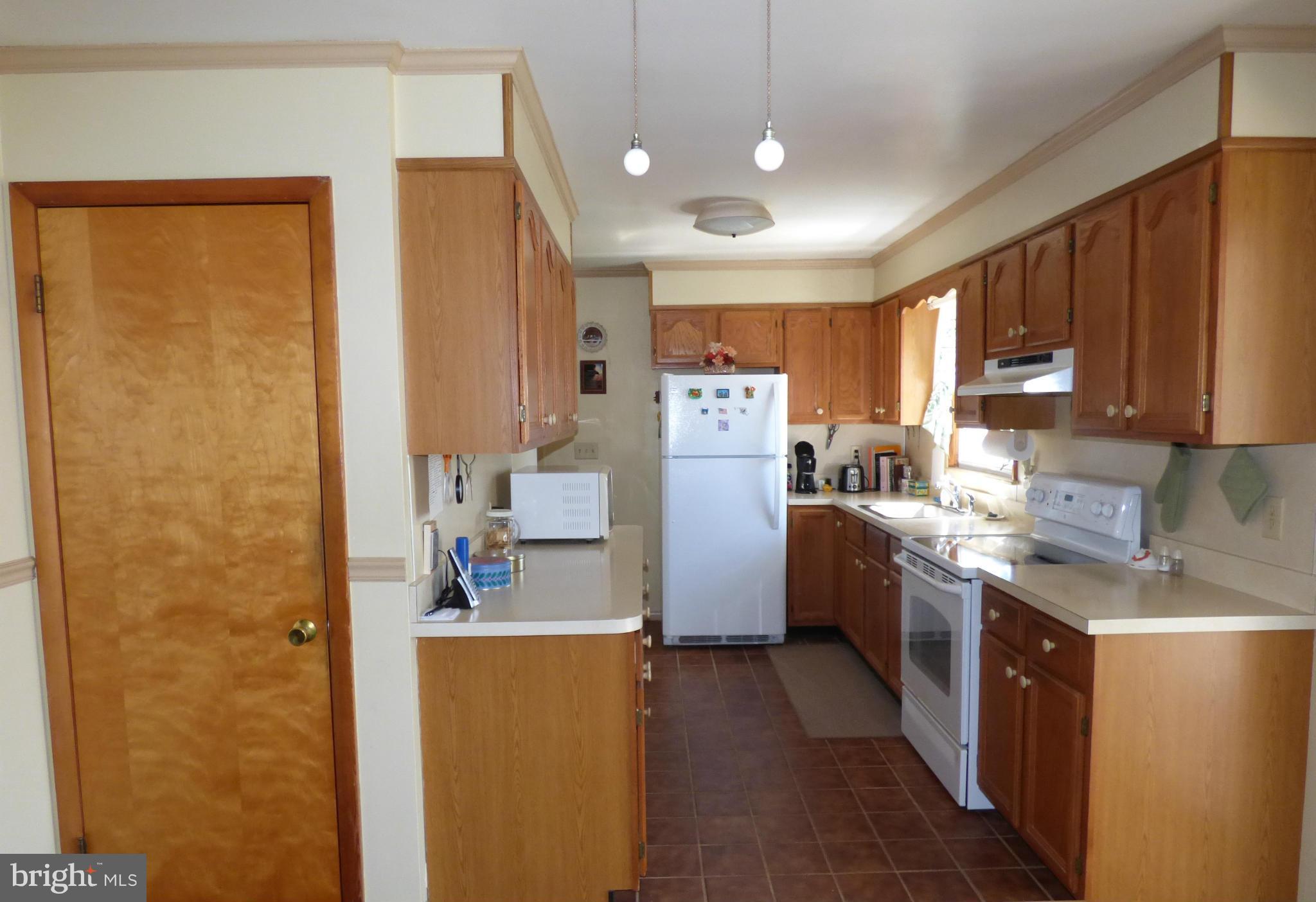 4983 Wentz Road Manchester, MD 21102 - Photo 5 of 21 Convenient Galley Kitchen with Large Pantry