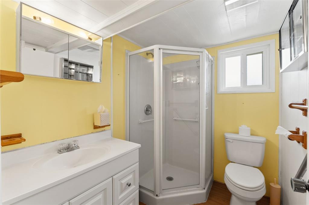 2092 Culbreath Road, Unit C52 Brooksville, FL 34602 - Photo 13 of 33 a bathroom with a sink a toilet and shower