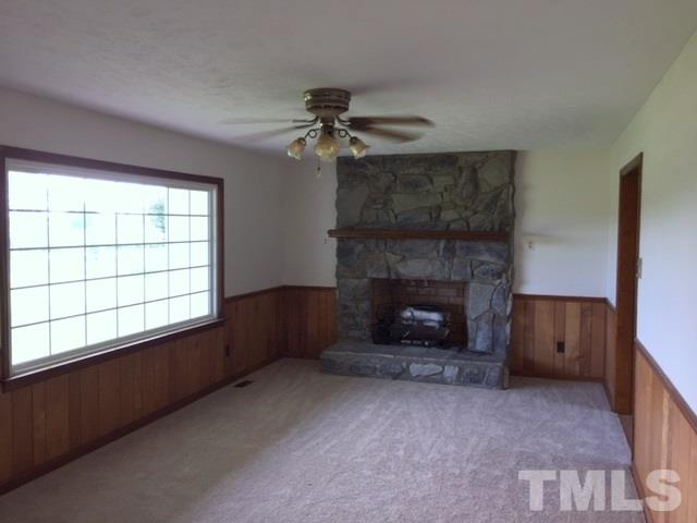 940 Cannan Road Mount Olive, NC 28365 - Photo 3 of 10 a living room with furniture and a fireplace