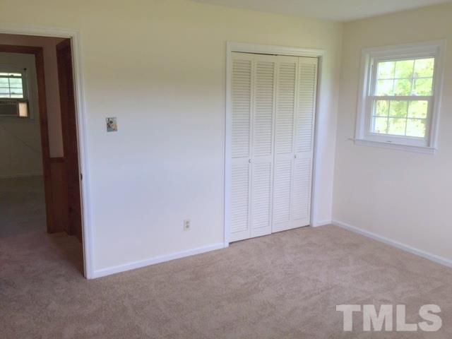 940 Cannan Road Mount Olive, NC 28365 - Photo 6 of 10 an empty room with windows and closet
