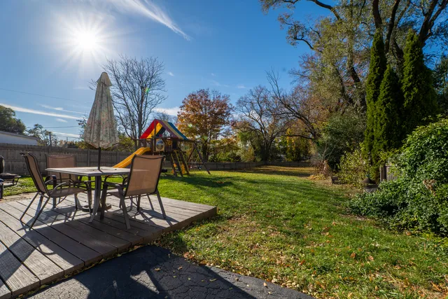 a view of a backyard with plants and a patio