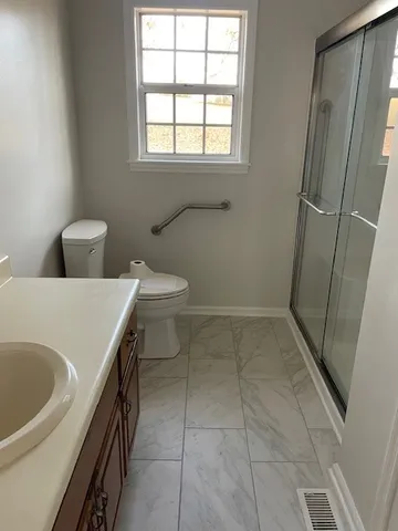 a bathroom with a sink and toilet