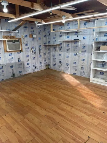 a view of an empty room with storage