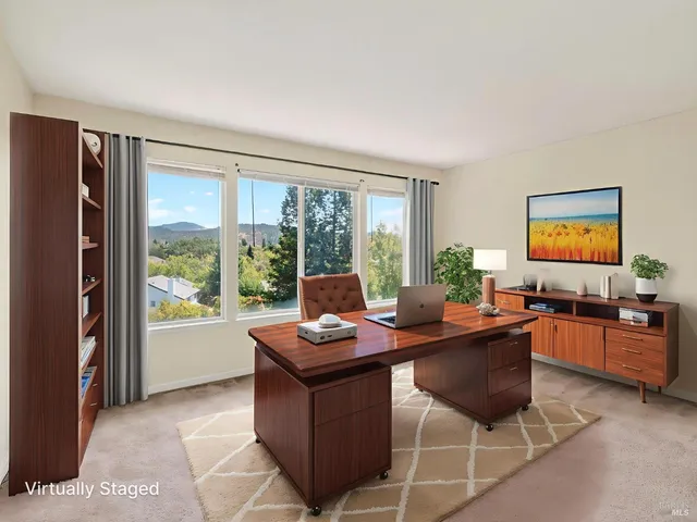 a bedroom with a bed and cabinets