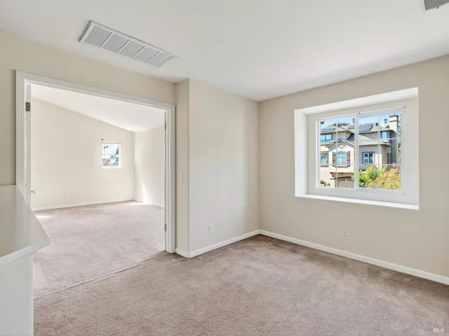 a view of balcony with wooden floor