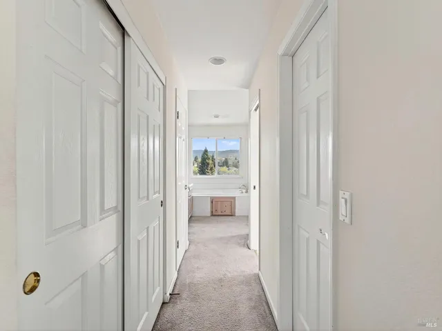 an aerial view of a house with a yard and garden