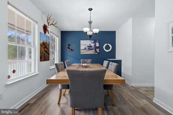 a bed sitting in a bedroom and chandelier