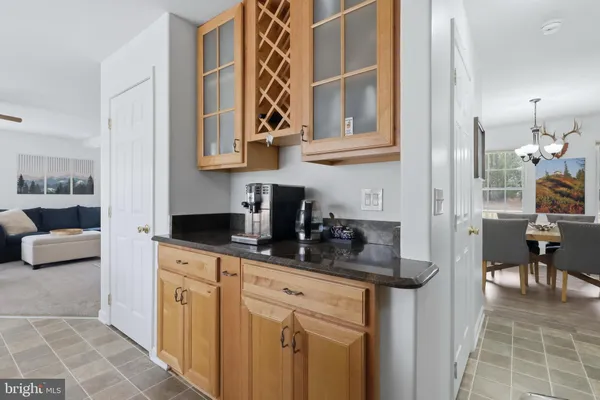 a kitchen with stainless steel appliances granite countertop a refrigerator sink and stove