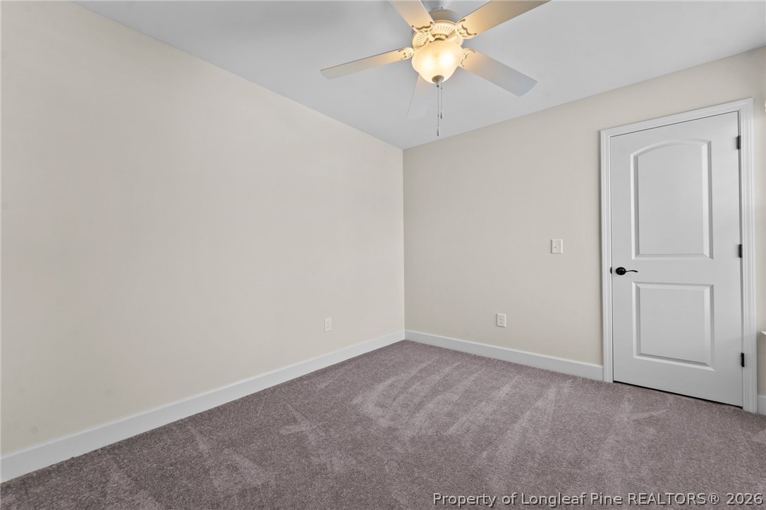 141 Pine Hawk Drive Spring Lake, NC 28390 - Photo 18 of 21 an empty room with a chandelier fan and closet
