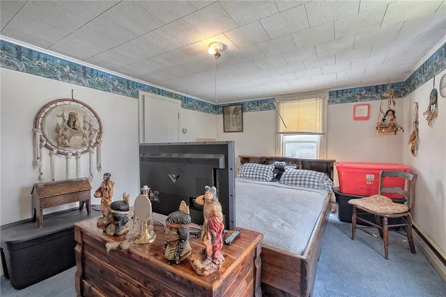 a living room with furniture a rug and a fireplace