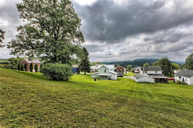 a view of a lake with parked cars