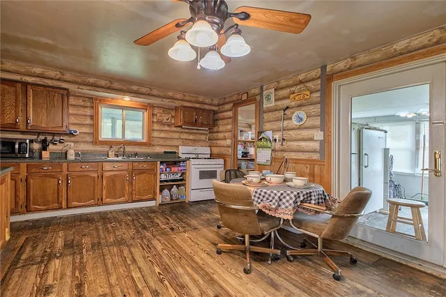 a view of a dining room with furniture and chandelier