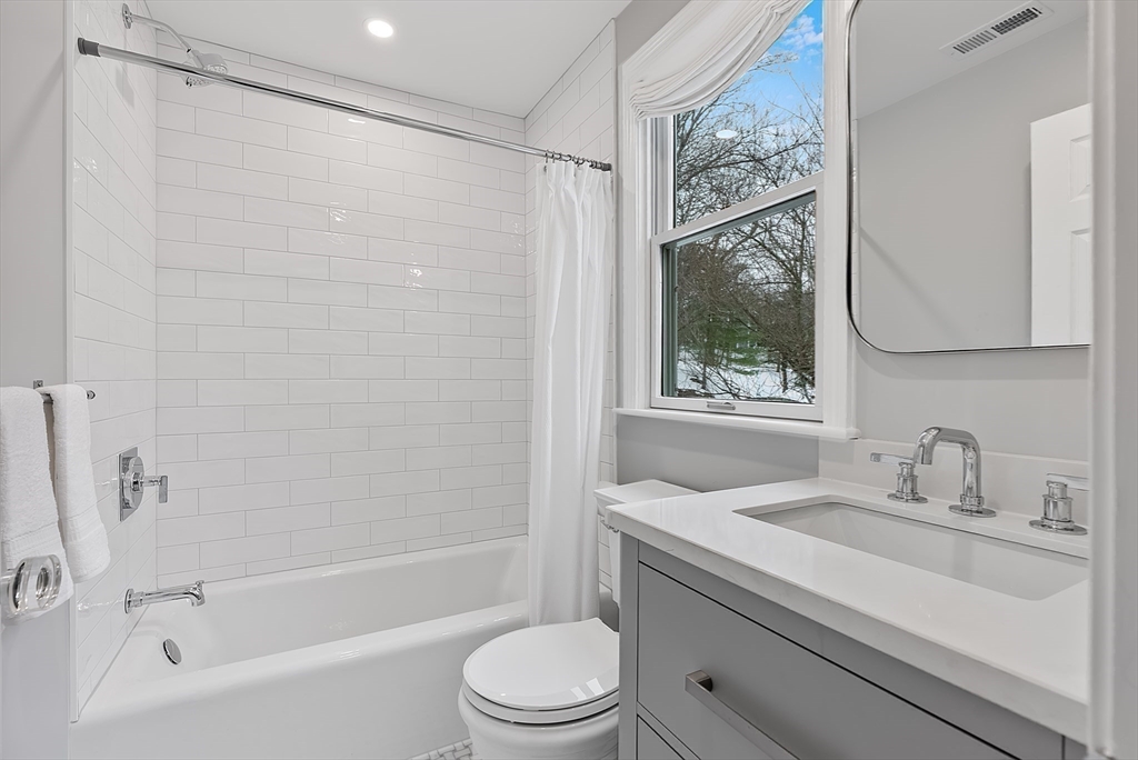 34 Pleasant Street, Unit 5 Wellesley, MA 02482 - Photo 15 of 31 a bathroom with a sink toilet and shower