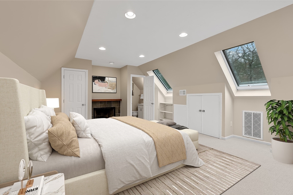 34 Pleasant Street, Unit 5 Wellesley, MA 02482 - Photo 19 of 31 a spacious bedroom with a large bed and a chandelier