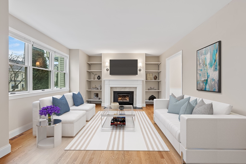 34 Pleasant Street, Unit 5 Wellesley, MA 02482 - Photo 5 of 31 a living room with furniture fireplace and window