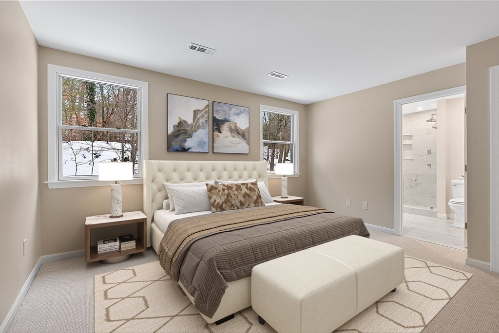 34 Pleasant Street, Unit 5 Wellesley, MA 02482 - Photo 10 of 31 a bedroom with a bed and a painting on the wall