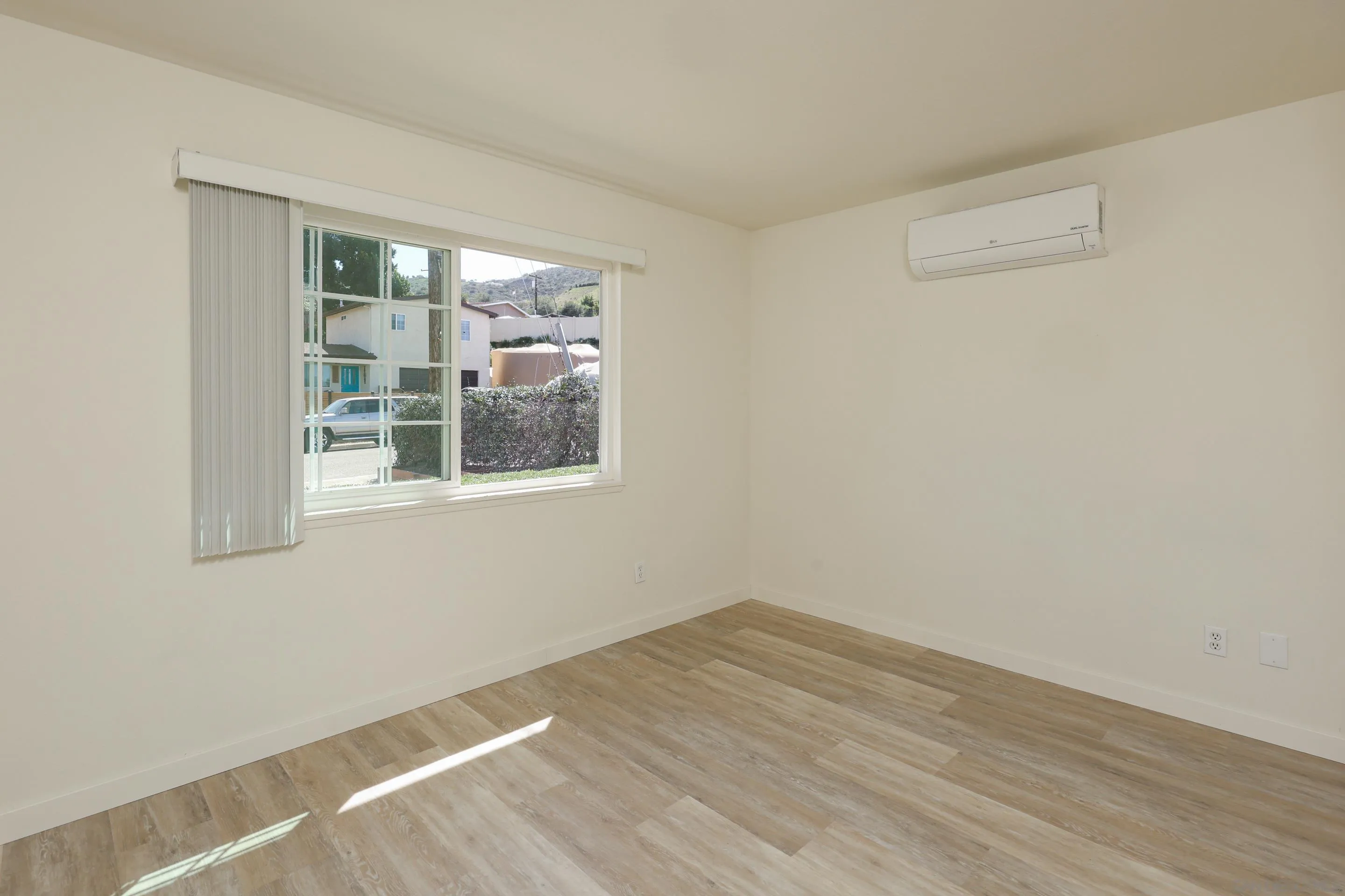 11102 Shadow Hill Way Santee, CA 92071 - Photo 16 of 30 a view of empty room with wooden floor and fan