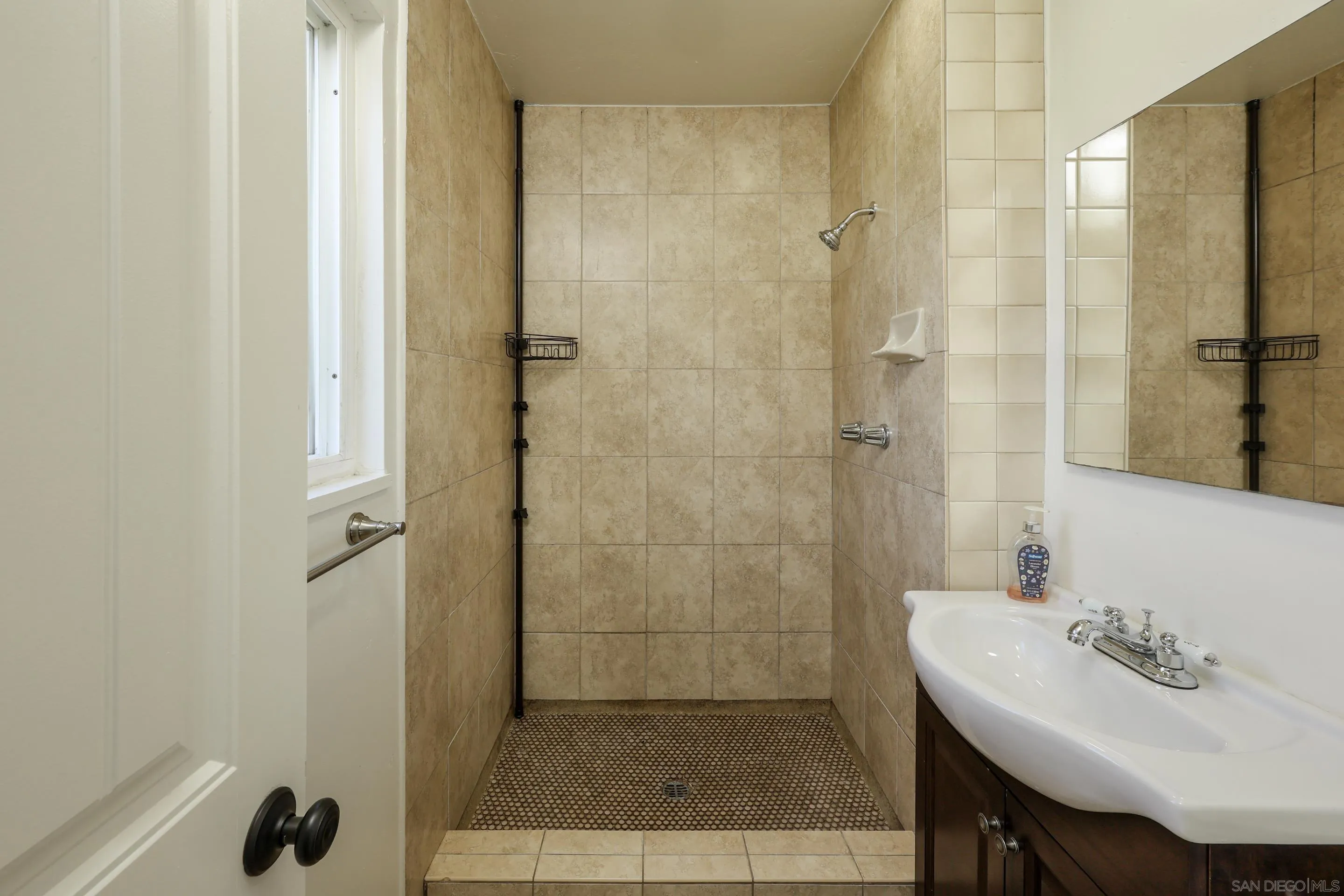 11102 Shadow Hill Way Santee, CA 92071 - Photo 17 of 30 a bathroom with a sink a shower and a mirror