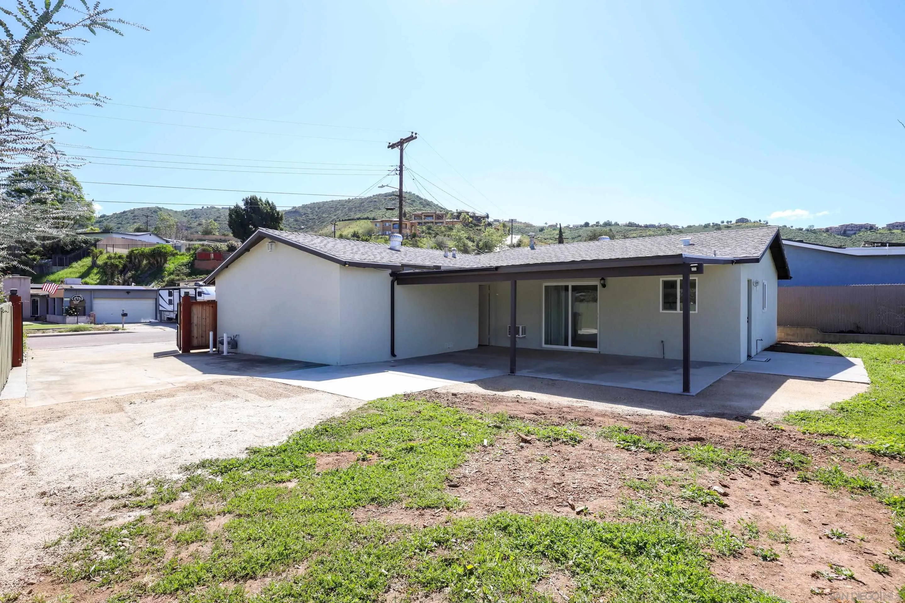 11102 Shadow Hill Way Santee, CA 92071 - Photo 21 of 30 a front view of a house with a garden