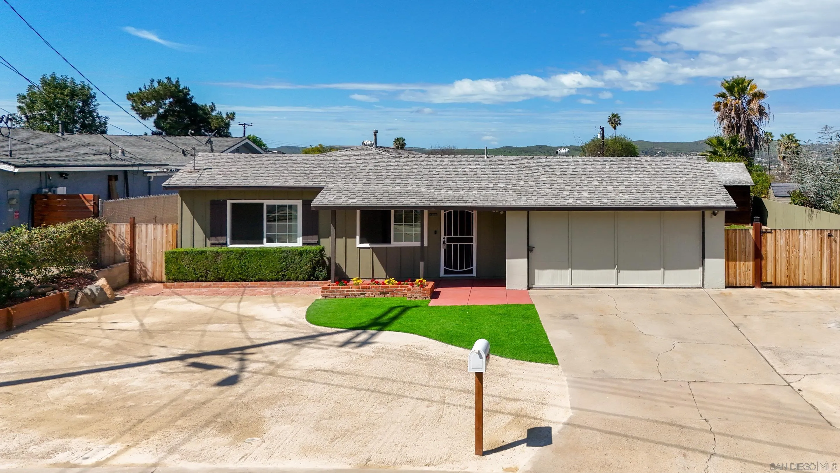 11102 Shadow Hill Way Santee, CA 92071 - Photo 26 of 30 a front view of a house with a yard and potted plants