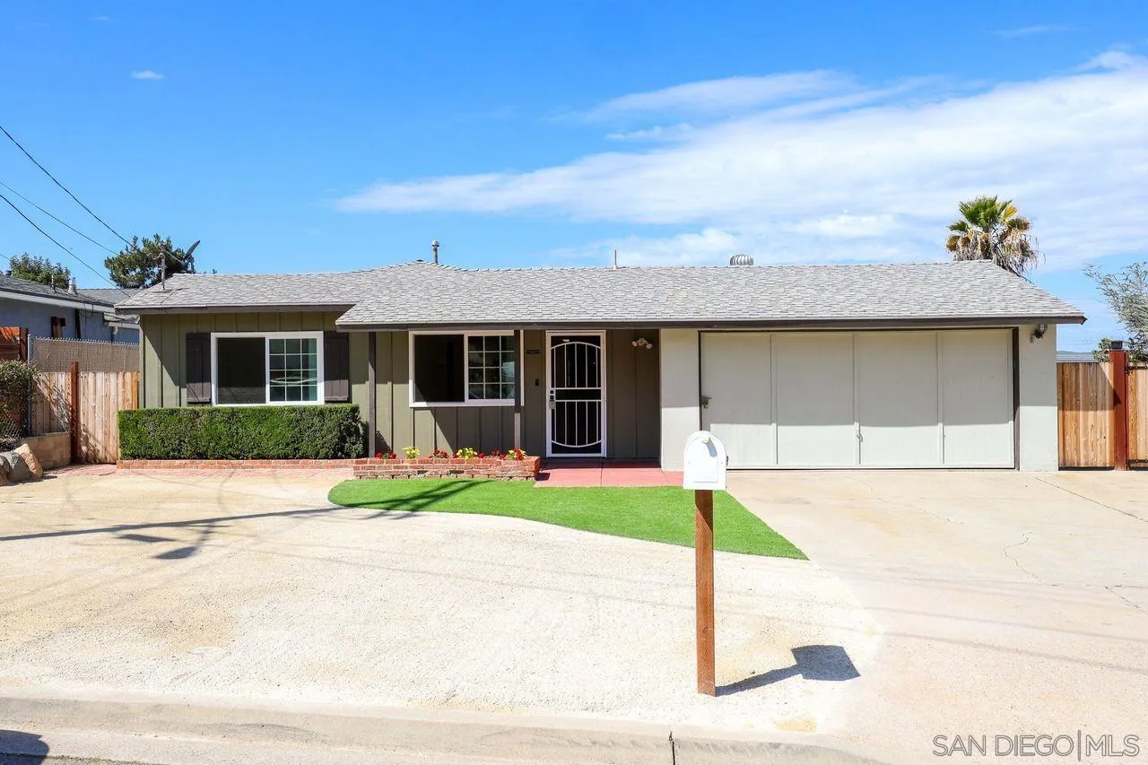 11102 Shadow Hill Way Santee, CA 92071 - Photo 3 of 30 a front view of a house with a yard and porch